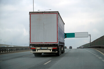 Heavy Truck Transports Cargo on a Highway