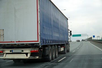 Heavy Truck Transports Cargo on a Highway