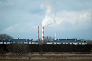 Industrial Power Plant Chimneys Emit Smoke into Sky