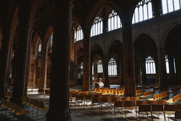 Obraz premium Gothic church interior with empty rows of chairs