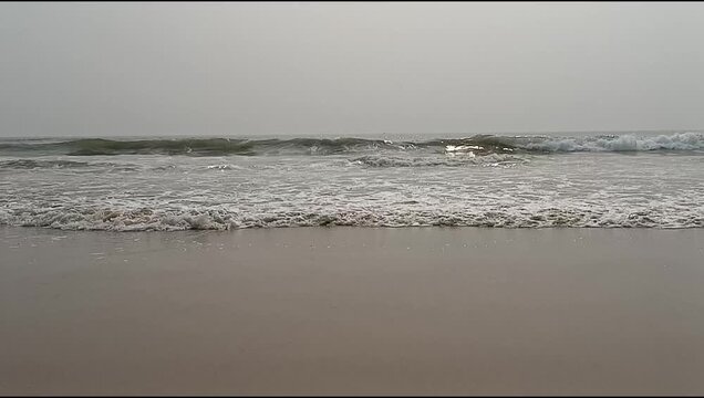 Transparent Sea Waves Revealing Sandy Bottom in Slow Motion