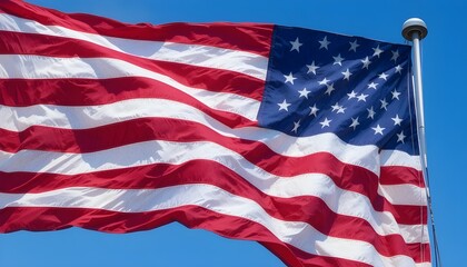 Fototapeta premium American flag waving proudly in the wind on a sunny day