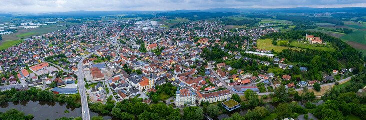 Fototapeta premium Aerial panoramic view beside the city Schwarzenfeld in Germany, Bavaria on a cloudy spring noon.