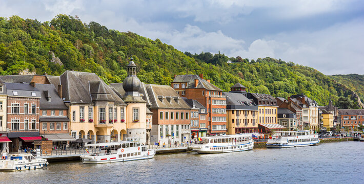 Panorama of tourist ships in at the waterfront in Dinant, Belgium