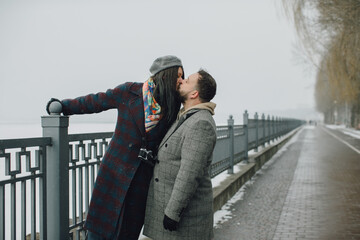 Romantic couple kissing in winter love story