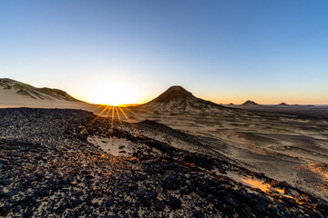 Fototapeta premium Sunrise Over Rocky Desert Hills in Giza, Egypt