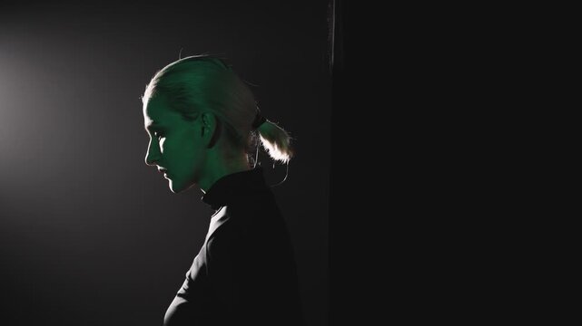 Blonde woman stepping into spotlight, public speech concept