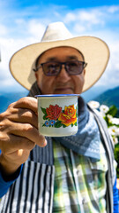 A farmer drinking coffee in the mountain