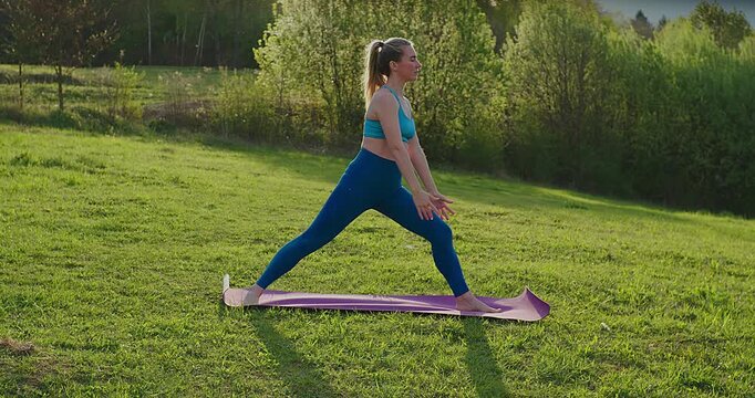Woman Practicing Yoga in Park on Sunny Spring Day, Outdoor Wellness and Mindfulness Concept