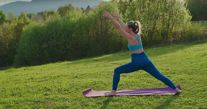 Woman Practicing Yoga in Park on Sunny Spring Day, Outdoor Wellness and Mindfulness Concept