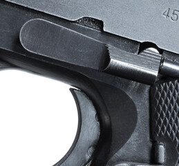 Close-up of a semi-auto pistols slide stop just outside the disassembly notch