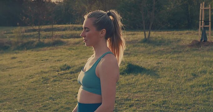 Woman Practicing Yoga in Park on Sunny Spring Day, Outdoor Wellness and Mindfulness Concept