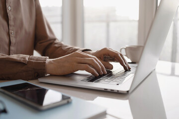 Man hands typing on computer keyboard closeup, businessman or student using laptop at home, online...