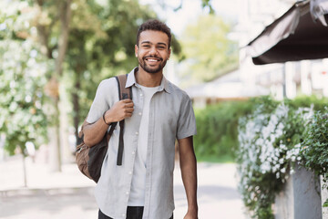 Young student man in a city looking at camera, African-american businessman portrait, Confident men...