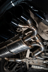 Installed performance car exhaust system after TIG welding modification