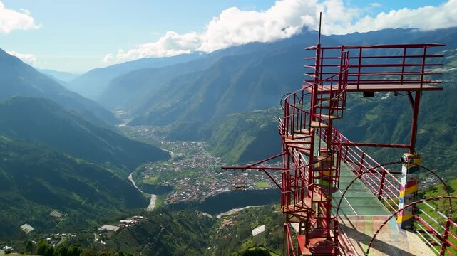 Cinematic drone footage of the transparent glass floor skywalk at Mirador Pies de Dios featuring a terrifying high-altitude view of Banos city and the surrounding Andean mountains