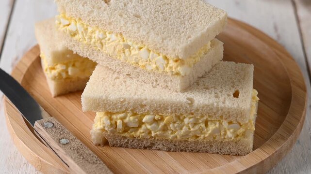 Tamago Sando sandwich on wooden table. Traditional japanese sandwich