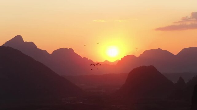 Sunset Paragliding Over Vang Vieng Mountains