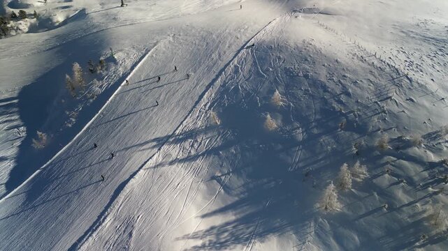 Skiers on a slope in Turracher H&ouml;he - top down aerial view