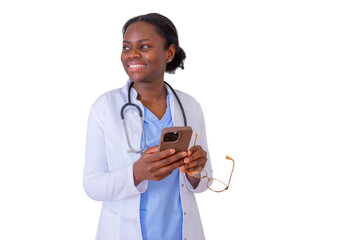 African american female doctor smiling, holding a mobile phone and eyeglasses, communicating technology and healthcare services