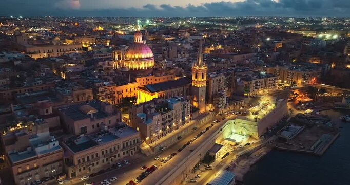 Aerial view of amazing evening night view of church dome in Valletta city. Malta island