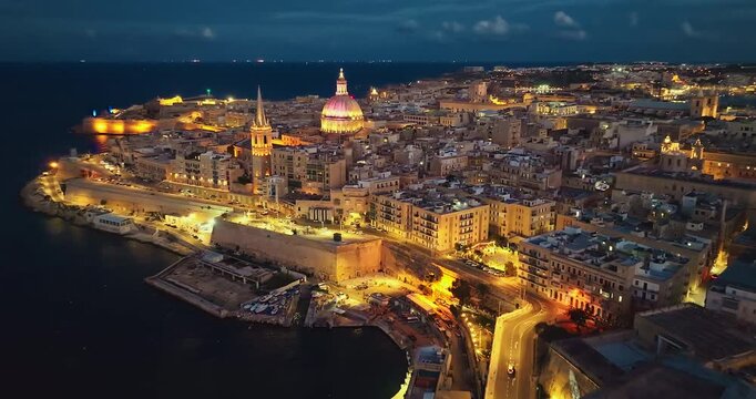 Aerial view of amazing evening night view of church dome in Valletta city. Malta island