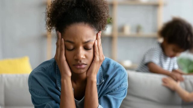 Exhausted mother overwhelmed by parenting stress at home while energetic children play background, emotional burnout, mental fatigue, noise overload, modern motherhood pressure family life imbalance