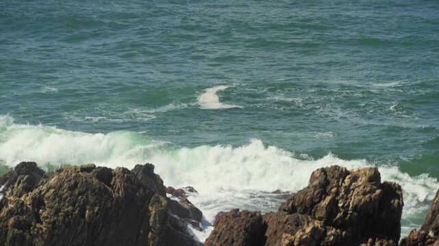 ocean surface with rolling swell at Sawtell beach, Sawtell, New South Wales, Australia