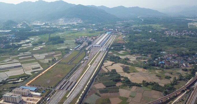 Aerial Highway Interchange Through Mountain Valley Farmland