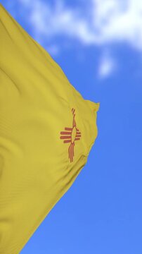 New Mexico State Flag Waving Against Clear Blue Sky