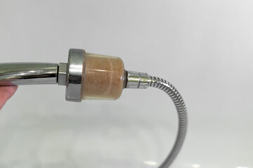 A filter for purifying hard water in the faucet.A device for delaying rust from a sewer pipe.The nozzle on the water hose.