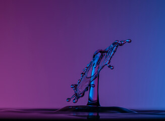 Color drops splash with umbrella or balls in fresh water