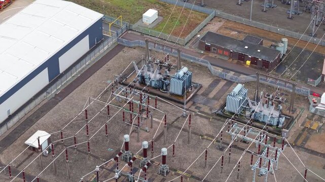 Aerial view of Enderby Substation National Grid showing buildings, transformers, and power lines in a symmetrical layout, Enderby, United Kingdom.