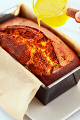 Fresh baking delicious orage loaf cake with syrup