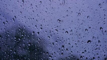 raindrops on the window glass, water texture background concept