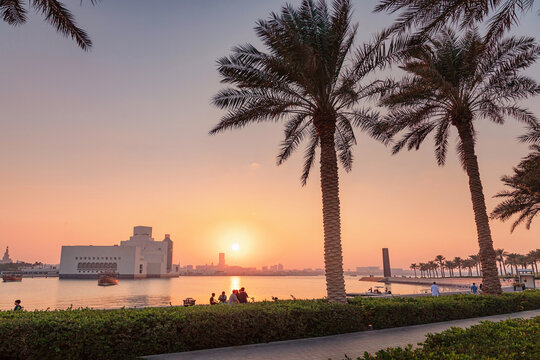 29 November 2025, Doha, Qatar: Museum of Islamic Art, reflecting the warm hues of sunset across the water