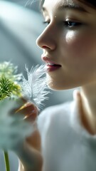 Close-up of luminous skin with a radiant dewy sheen and gentle feather touch. Soft reflections highlight hydration in a high-end skincare editorial style.