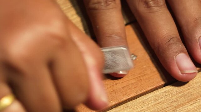 Filing Fingernails Using Nail File Close Up