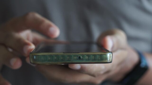 man scrolling mobile phone screen. internet browsing, social media and marketing	