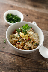 Savory oatmeal porridge with tomatoes and cheese