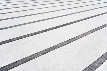 Fototapeta premium White pedestrian crossing lines on the asphalt