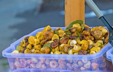 Organic dry figs fruit pile in box sold outside on a market