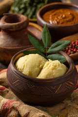 A close-up of "Fufu" (cassava dough), freshly pounded and served with a rich groundnut sauce, highlighting a staple food and traditional preparation.