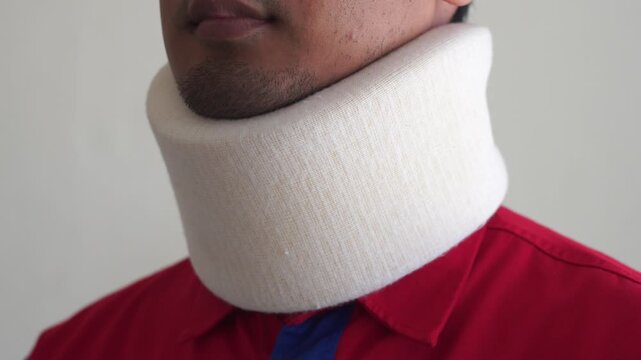 A sick Man Wearing a Cervical Collar to fix a neck fracture. Medical cervical collar
