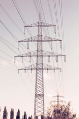 High voltage powerlines in Germany. Filtered color retro style tone photo.