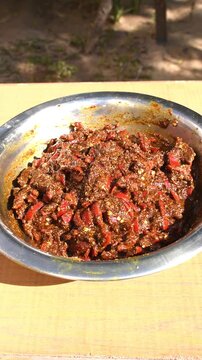 Red chilli or lal mirch ka achar at natural sunlight. vertical