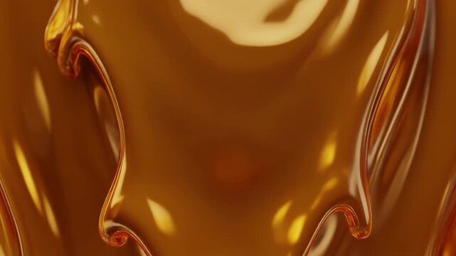 Luxurious thick golden liquid dripping onto a beautiful wavy reflective amber syrup surface abstract background texture