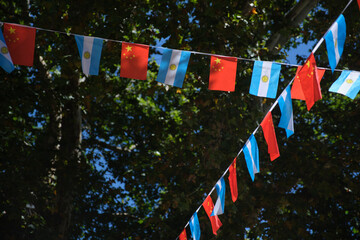 Argentine and Chinese flags hanging together.