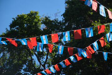 Argentine and Chinese flags hanging together.