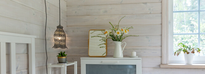 Wide nordic bedroom interior banner background, white dresser, spring flowers, mirror, hanging lamp, soft natural window light, calm scandinavian home decor, copy space wall for header design, web use